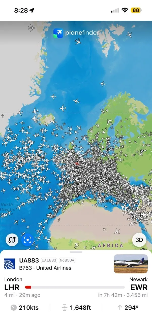 A screenshot of the app Plane Finder showing many plane shaped markers.